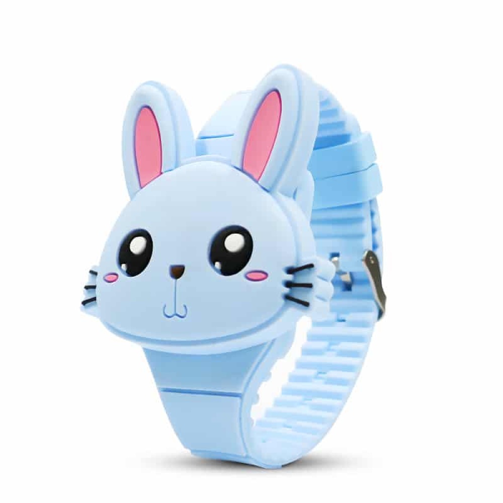 Elektronische Mädchenuhr in Form eines niedlichen und farbenfrohen Hasen Eine elektronische Uhr für Mädchen in Form eines niedlichen Kaninchens und in blauer Farbe. Sie hat ein blaues Schnallenarmband.
