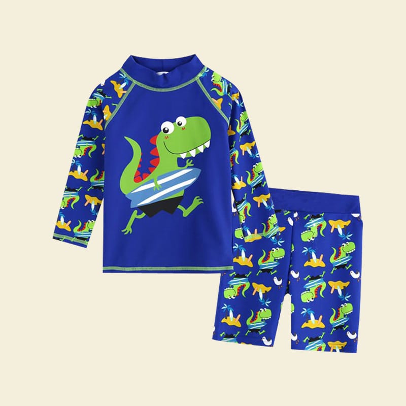 kindertrikot, blau, mit einem Dinosauriermotiv darauf, bestehend aus einem langärmeligen T-Shirt und einer kurzen Hose
