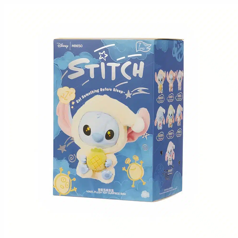 Boite en carton avec un stitch en pyjama dessus